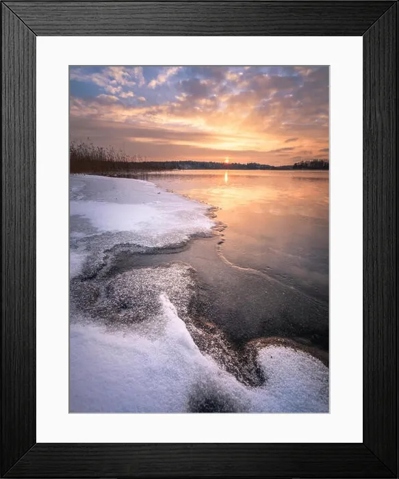 Framed Print : Scenic winter landscape with frozen lake and sunset at evening time in Finland Framed Print : Scenic winter landscape with frozen lake and sunset at evening time in Finland