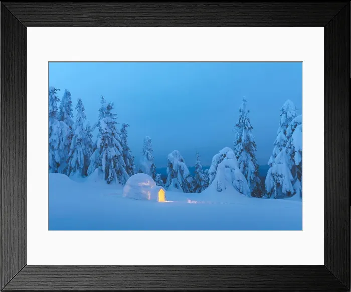Framed Print : Snow igloo luminous from the inside in the winter Carpathian mountains. Snow-covered firs in the evening light in the background Framed Print : Snow igloo luminous from the inside in the winter Carpathian mountains. Snow-covered firs in the evening light in the background