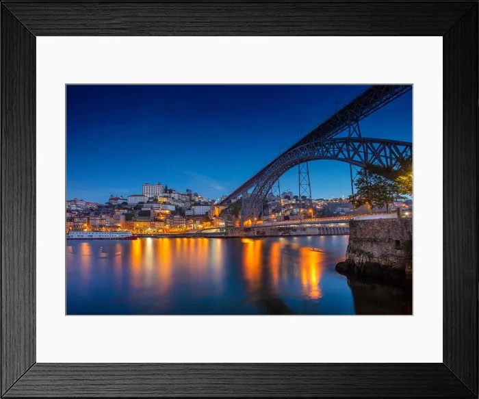Framed Print : Porto, Portugal. Cityscape image of Porto, Portugal with reflection of the city in the Douro River and the Luis I Bridge during twilight blue hour Framed Print : Porto, Portugal. Cityscape image of Porto, Portugal with reflection of the city in the Douro River and the Luis I Bridge during twilight blue hour