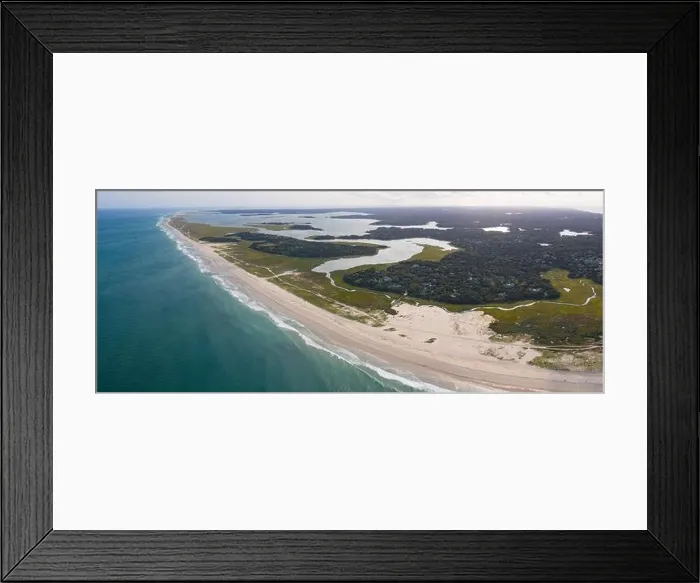 Framed Print : The cold water of the Atlantic Ocean washes onto a beautiful sandy beach on Cape Cod, Massachusetts. This scenic peninsula is a popular vacation area Framed Print : The cold water of the Atlantic Ocean washes onto a beautiful sandy beach on Cape Cod, Massachusetts. This scenic peninsula is a popular vacation area