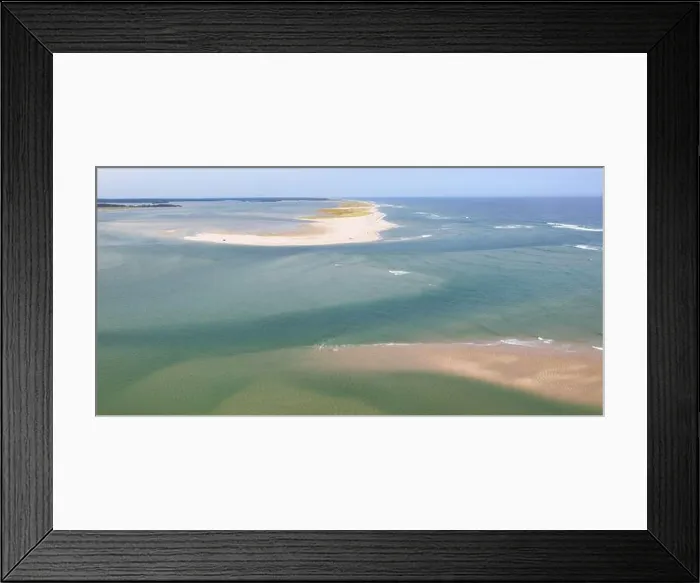 Framed Print : The cold water of the Atlantic Ocean washes onto a beautiful sandy beach on Cape Cod, Massachusetts. This scenic peninsula is a popular vacation area Framed Print : The cold water of the Atlantic Ocean washes onto a beautiful sandy beach on Cape Cod, Massachusetts. This scenic peninsula is a popular vacation area