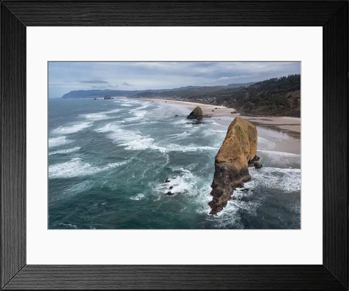 Framed Print : The Pacific Ocean gently washes against a massive sea stack along the Oregon's scenic shoreline, not far west of Portland Framed Print : The Pacific Ocean gently washes against a massive sea stack along the Oregon's scenic shoreline, not far west of Portland
