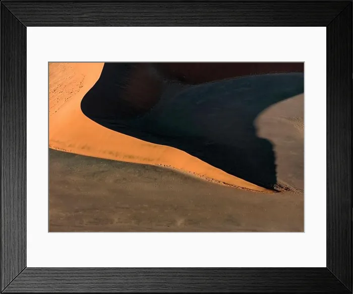 Framed Print : Contrasted abstract of the Oxide rich red sand dunes in the great sand sea of Namibia Framed Print : Contrasted abstract of the Oxide rich red sand dunes in the great sand sea of Namibia