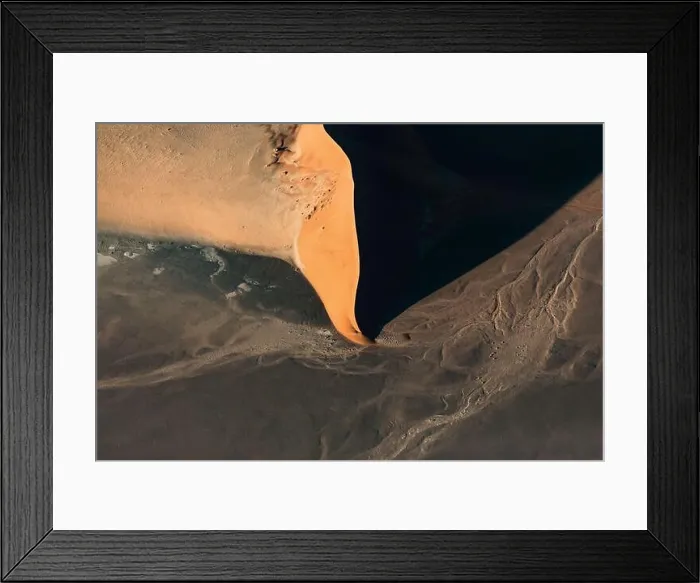 Framed Print : Contrasted abstract of the Oxide rich red sand dunes in the great sand sea of Namibia Framed Print : Contrasted abstract of the Oxide rich red sand dunes in the great sand sea of Namibia