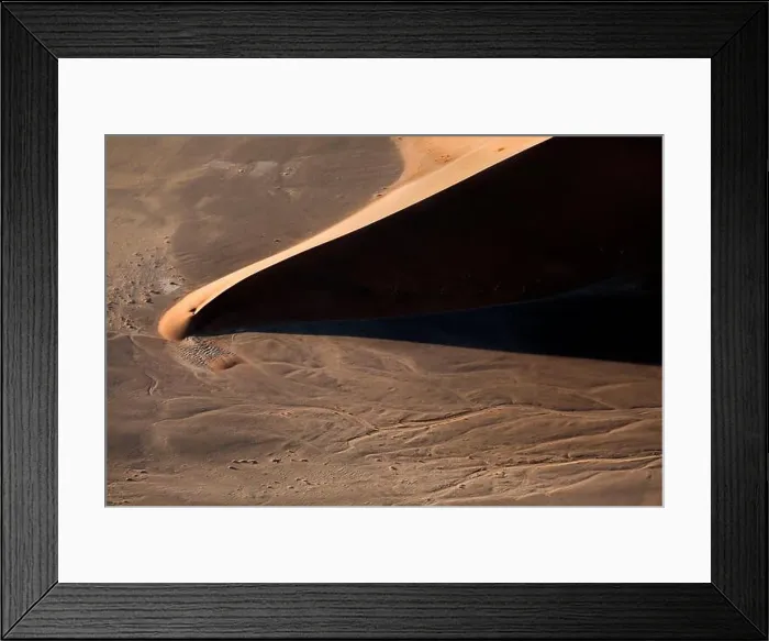 Framed Print : Contrasted abstract of the Oxide rich red sand dunes in the great sand sea of Namibia Framed Print : Contrasted abstract of the Oxide rich red sand dunes in the great sand sea of Namibia