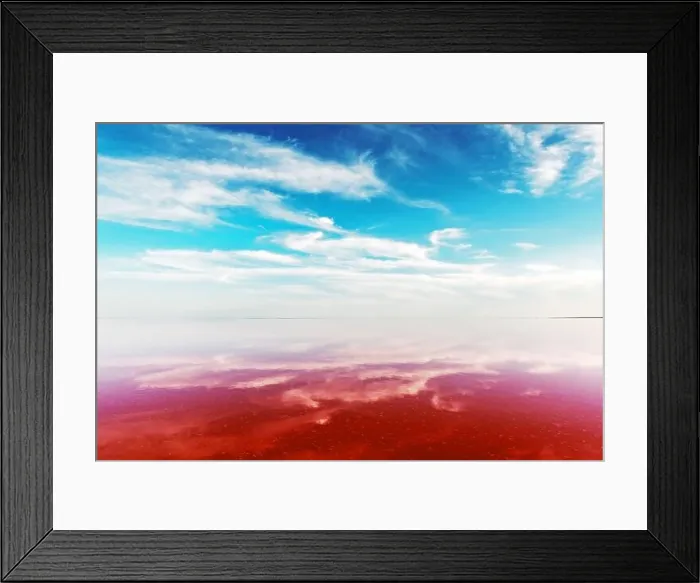 Framed Print : Pink lake water under blue sky with fluffy clouds in summer day. Creative color concept Framed Print : Pink lake water under blue sky with fluffy clouds in summer day. Creative color concept