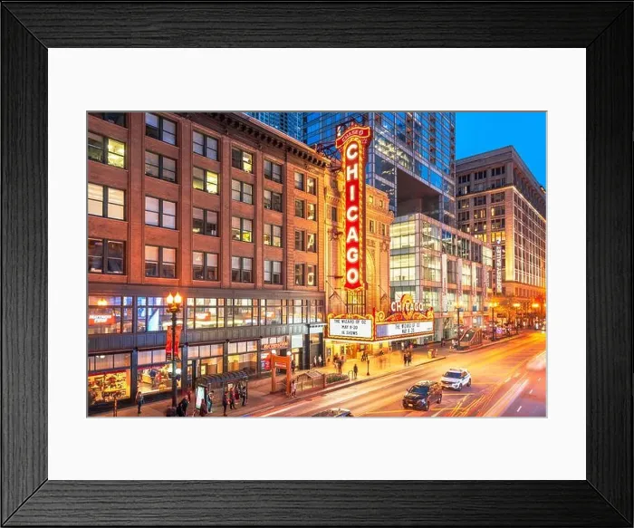 Framed Print : CHICAGO, ILLINOIS - MAY 10, 2018: The landmark Chicago Theatre on State Street at twilight. The historic theater dates from 1921 Framed Print : CHICAGO, ILLINOIS - MAY 10, 2018: The landmark Chicago Theatre on State Street at twilight. The historic theater dates from 1921