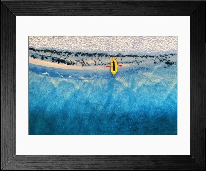 Framed Print : Yellow packraft rubber boat with red padle and turquoise water waves from top view. Beach with yellow sand glowing by sunlight Framed Print : Yellow packraft rubber boat with red padle and turquoise water waves from top view. Beach with yellow sand glowing by sunlight