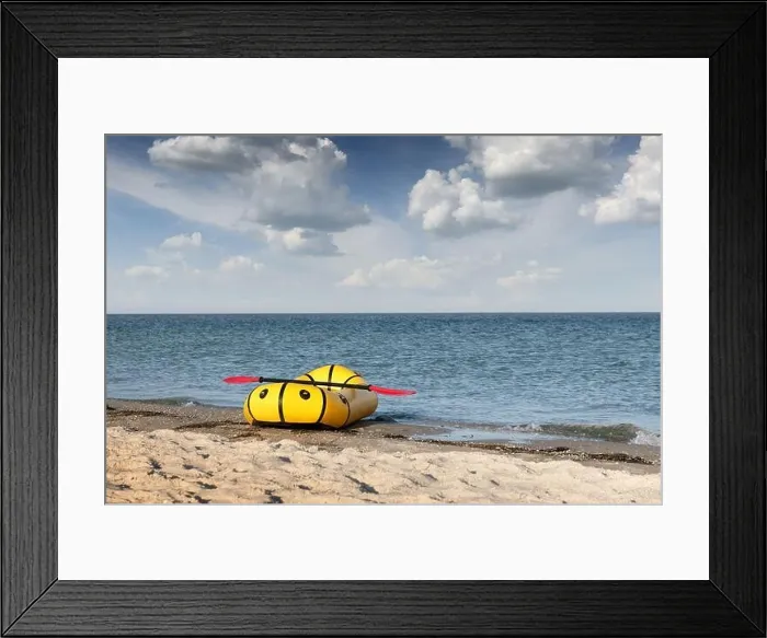Framed Print : Yellow packraft rubber boat with red padle on a sea coast. Packrafting. Active lifestile concept Framed Print : Yellow packraft rubber boat with red padle on a sea coast. Packrafting. Active lifestile concept
