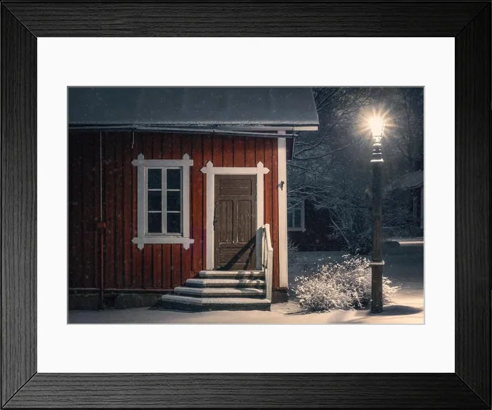 Framed Print : Public cozy old cafe place with snow mood at winter evening in Finland. Light snowflakes. This place is open only in summer time