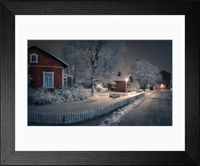 Framed Print : Public park with cozy cafe place and snow covered trees at winter evening in Finland. Cafe place is open only in summertime