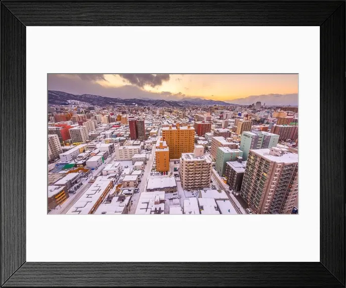 Framed Print : Sapporo, Japan winter skyline view towards the mountain at dusk