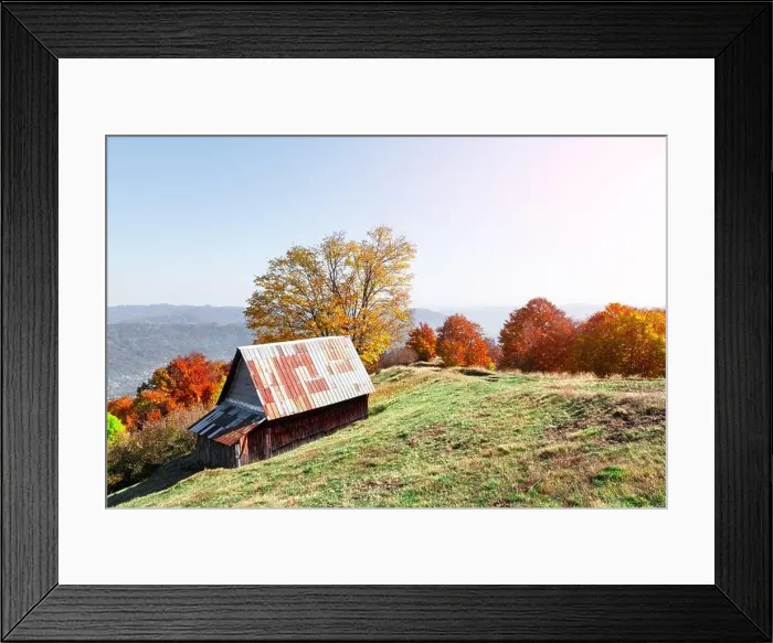 Framed Print : Picturesque meadow with wooden house and red beech trees in the autumn mountains. Landscape photography Framed Print : Picturesque meadow with wooden house and red beech trees in the autumn mountains. Landscape photography