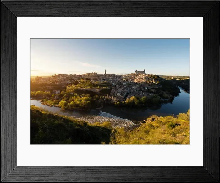 Framed Print : Panoramic view of the medieval center of the city of Toledo, Spain. It features the Tejo river, the Cathedral and Alcazar of Toledo, Spain Framed Print : Panoramic view of the medieval center of the city of Toledo, Spain. It features the Tejo river, the Cathedral and Alcazar of Toledo, Spain