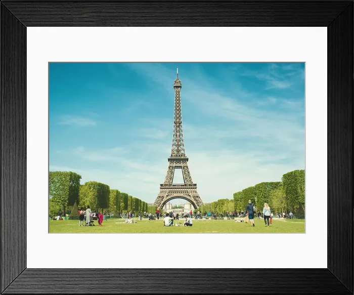 Framed Print : Paris, France - May 6, 2016 : Tourists chilling in park near Eiffel Tower Paris, France. In year 2016 more than 15 million tourists visited the city of Framed Print : Paris, France - May 6, 2016 : Tourists chilling in park near Eiffel Tower Paris, France. In year 2016 more than 15 million tourists visited the city of