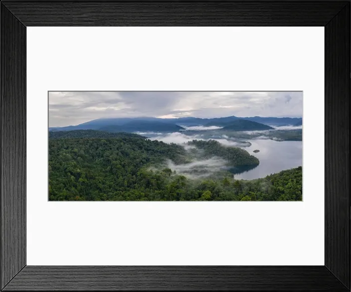 Framed Print : Seen from above, early morning mist drifts over tropical islands in Raja Ampat, Indonesia. This region is known as the heart of the Coral Triangle Framed Print : Seen from above, early morning mist drifts over tropical islands in Raja Ampat, Indonesia. This region is known as the heart of the Coral Triangle