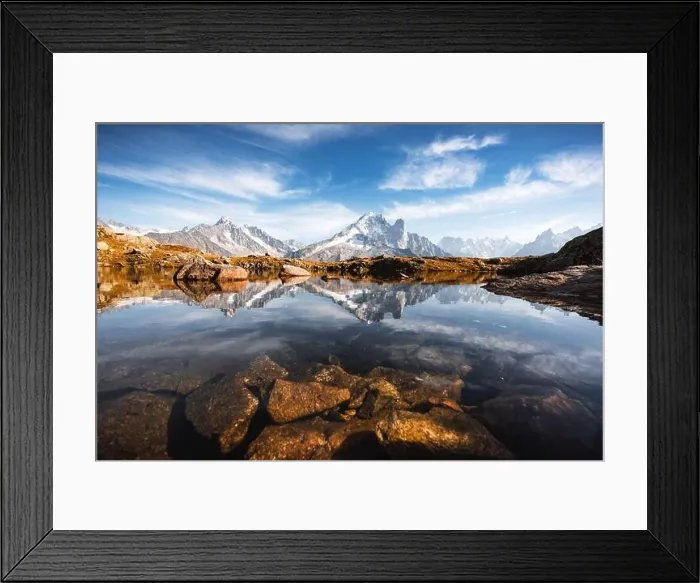 Framed Print : Incredible view of clear water and sky reflection on Lac Blanc lake in France Alps. Monte Bianco mountains range on background Framed Print : Incredible view of clear water and sky reflection on Lac Blanc lake in France Alps. Monte Bianco mountains range on background