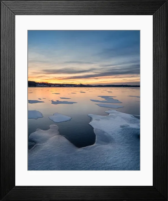 Framed Print : Scenic winter landscape with frozen lake, sunset and beautiful evening light in Finland Framed Print : Scenic winter landscape with frozen lake, sunset and beautiful evening light in Finland
