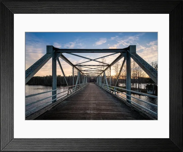 Framed Print : Scenic landscape with old metal bridge and road at autumn evening in Finland Framed Print : Scenic landscape with old metal bridge and road at autumn evening in Finland