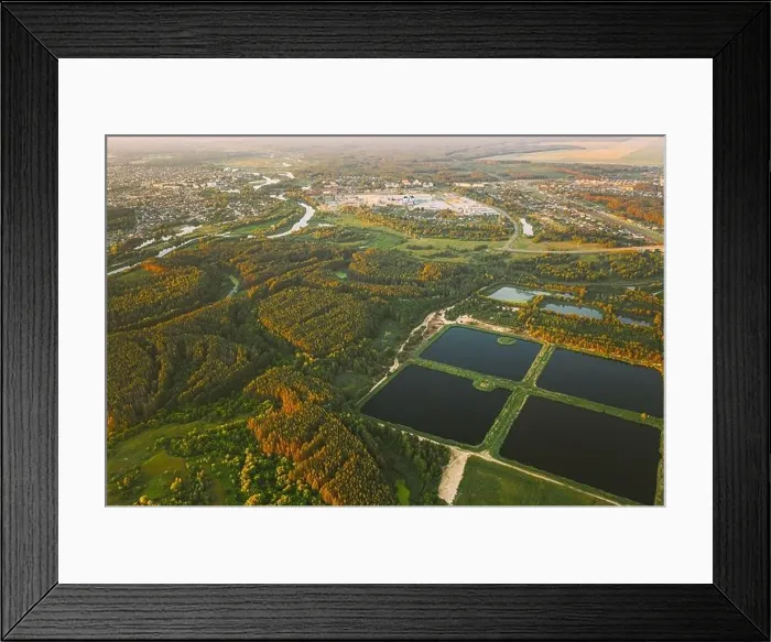Framed Print : Aerial View Retention Basins, Wet Pond, Wet Detention Basin Or Stormwater Management Pond, Is An Artificial Pond With Vegetation Around The Perimeter Framed Print : Aerial View Retention Basins, Wet Pond, Wet Detention Basin Or Stormwater Management Pond, Is An Artificial Pond With Vegetation Around The Perimeter