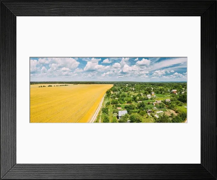 Framed Print : Countryside Rural Landscape With Small Village, Gardens And Yellow Wheat Field In Spring Summer Day. Elevated View. Panorama Framed Print : Countryside Rural Landscape With Small Village, Gardens And Yellow Wheat Field In Spring Summer Day. Elevated View. Panorama