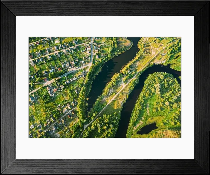 Framed Print : Aerial View Of Calm River And Village In Belarus, Europe. Green Forest Woods Landscape In Sunny Summer Evening. Top View Of Beautiful European Nature Framed Print : Aerial View Of Calm River And Village In Belarus, Europe. Green Forest Woods Landscape In Sunny Summer Evening. Top View Of Beautiful European Nature