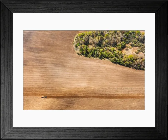 Framed Print : Tractor Plowing Field In Spring. Beginning Of Agricultural Season. Cultivator Pulled By A Tractor In Countryside Rural Field. Countryside Field Framed Print : Tractor Plowing Field In Spring. Beginning Of Agricultural Season. Cultivator Pulled By A Tractor In Countryside Rural Field. Countryside Field