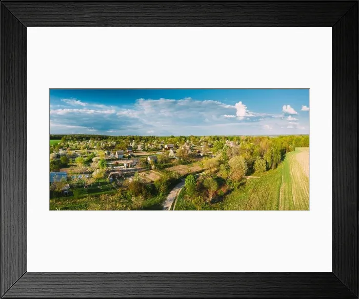 Framed Print : Countryside Rural Landscape With Small Village, Gardens And Green Field In Spring Summer Day. Elevated View. Panorama Framed Print : Countryside Rural Landscape With Small Village, Gardens And Green Field In Spring Summer Day. Elevated View. Panorama