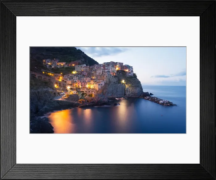 Framed Print : Fantastic landscape of Manarola city with costal rocks on a foreground. Cinque Terre National Park, Liguria, Italy, Europe