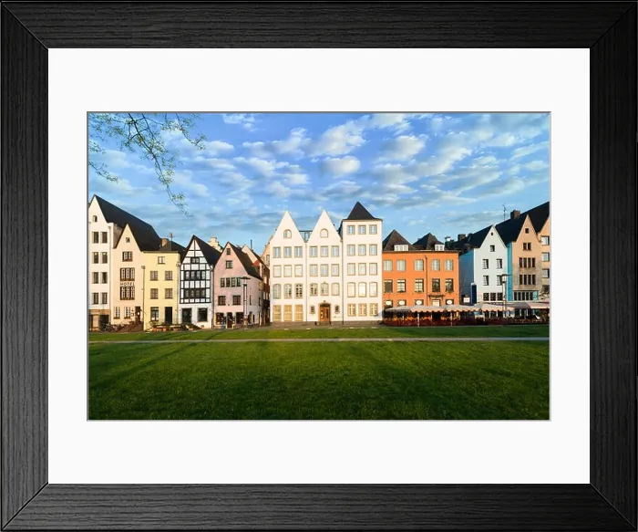 Framed Print : Houses and park in Cologne, Germany. Many of them are colourful, they are facing a public park with green grass and some trees. There is a Cologne bel Framed Print : Houses and park in Cologne, Germany. Many of them are colourful, they are facing a public park with green grass and some trees. There is a Cologne bel