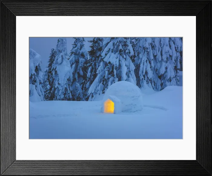 Framed Print : Snow igloo luminous from the inside in the winter Carpathian mountains. Snow-covered firs in the evening light in the background Framed Print : Snow igloo luminous from the inside in the winter Carpathian mountains. Snow-covered firs in the evening light in the background