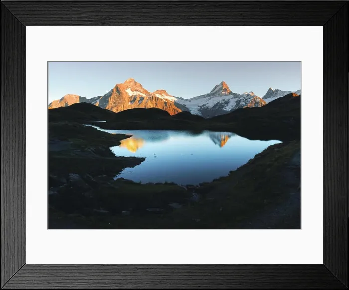 Framed Print : Picturesque view on Bachalpsee lake in Swiss Alps mountains. Snowy peaks of Wetterhorn, Mittelhorn and Rosenhorn on background. Switzerland
