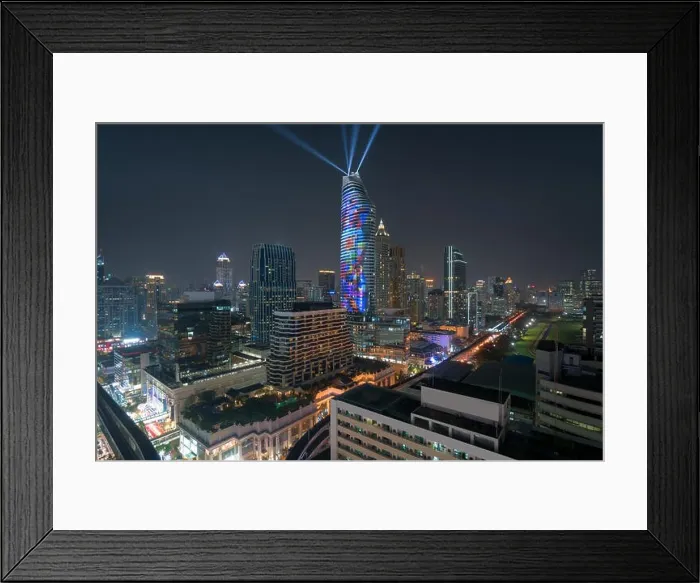 Framed Print : Night view with skyscraper in business district in Bangkok Thailand. Light show at Magnolias Ratchaprasong in Bangkok, Thailand Framed Print : Night view with skyscraper in business district in Bangkok Thailand. Light show at Magnolias Ratchaprasong in Bangkok, Thailand