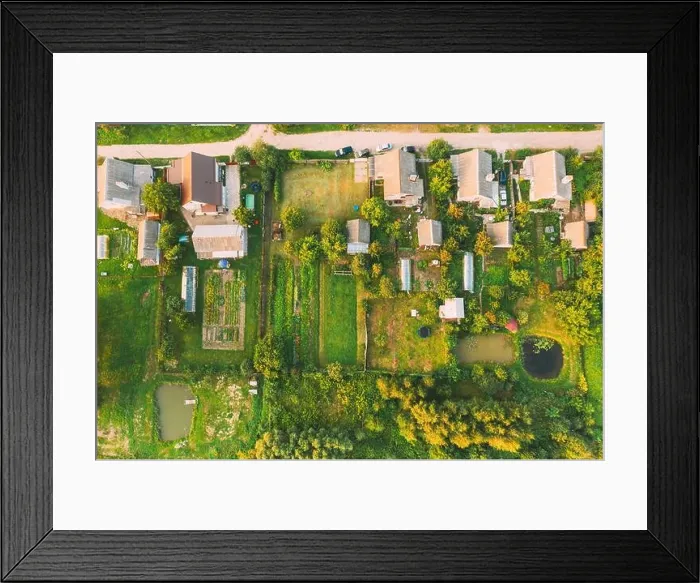 Framed Print : Aerial View Of Small Town Cityscape Skyline In Summer Day. Residential District, Houses And Garden Beds In Bird's-eye View Framed Print : Aerial View Of Small Town Cityscape Skyline In Summer Day. Residential District, Houses And Garden Beds In Bird's-eye View