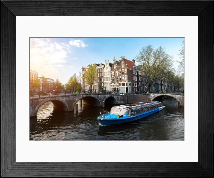 Framed Print : Amsterdam canal cruise ship with Netherlands traditional house in Amsterdam, Netherlands Framed Print : Amsterdam canal cruise ship with Netherlands traditional house in Amsterdam, Netherlands