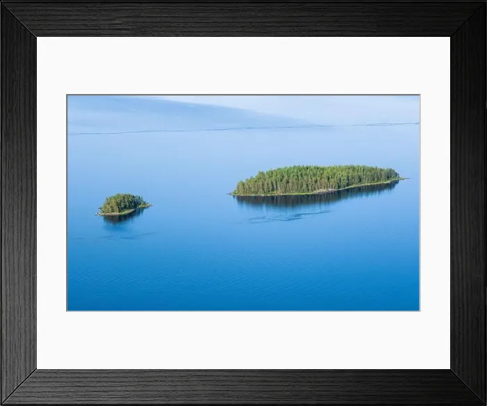 Framed Print : Scenic lake landscape with blue water and beautiful pine trees island at sunny summer day in National park Finland Framed Print : Scenic lake landscape with blue water and beautiful pine trees island at sunny summer day in National park Finland