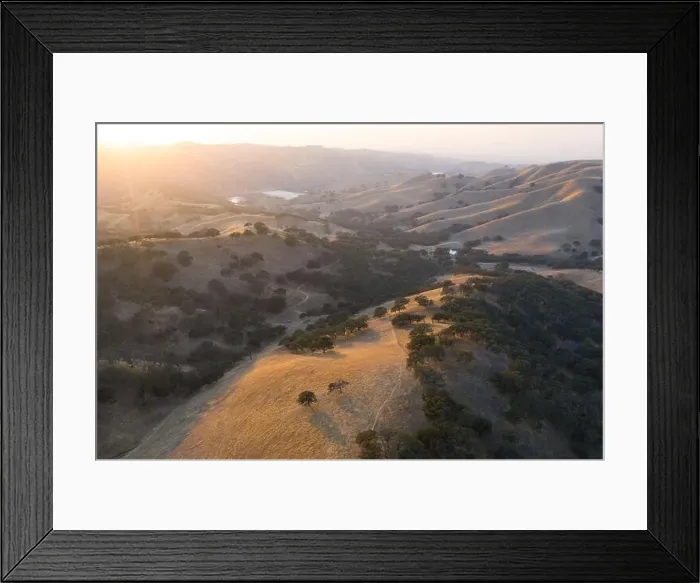 Framed Print : Evening sunlight shines on the rolling hills in Northern California. These beautiful, golden hills turn green once winter brings seasonal rains Framed Print : Evening sunlight shines on the rolling hills in Northern California. These beautiful, golden hills turn green once winter brings seasonal rains