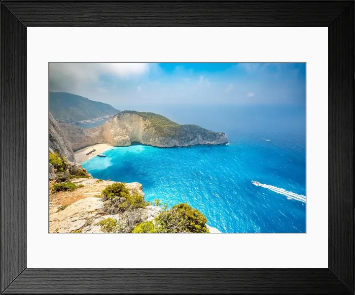 Framed Print : Navagio bay and Ship Wreck beach in summer. The most famous natural landmark of Zakynthos, Greek island in the Ionian Sea Framed Print : Navagio bay and Ship Wreck beach in summer. The most famous natural landmark of Zakynthos, Greek island in the Ionian Sea