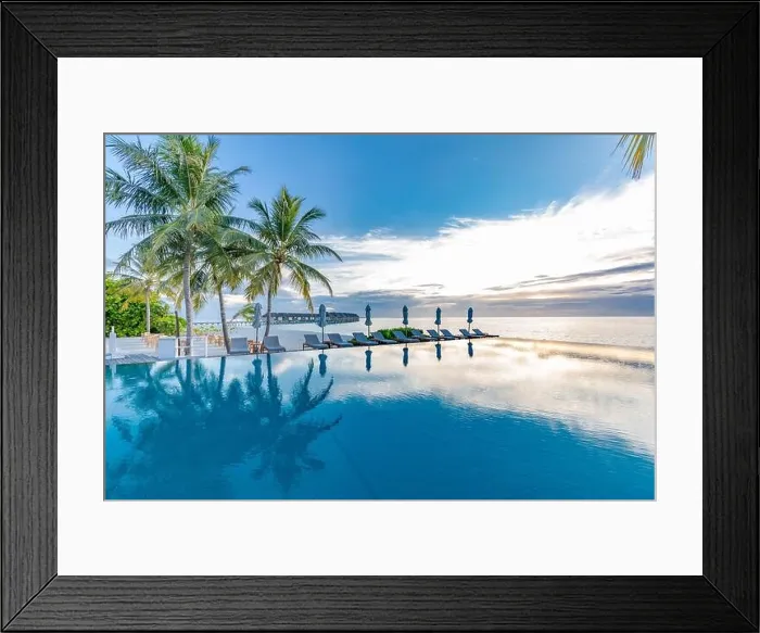 Framed Print : Summer beach swimming pool on sunny day with reflection of palm trees, tropical landscape, exotic island hotel resort concept. Luxury infinity pool Framed Print : Summer beach swimming pool on sunny day with reflection of palm trees, tropical landscape, exotic island hotel resort concept. Luxury infinity pool