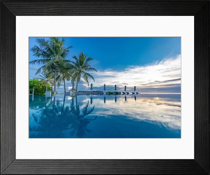Framed Print : Summer beach swimming pool on sunny day with reflection of palm trees, tropical landscape, exotic island hotel resort concept. Luxury infinity pool Framed Print : Summer beach swimming pool on sunny day with reflection of palm trees, tropical landscape, exotic island hotel resort concept. Luxury infinity pool