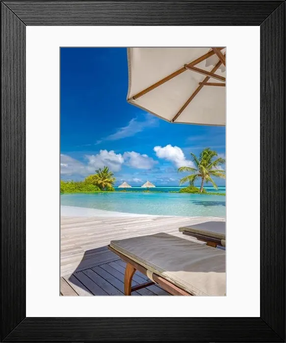 Framed Print : Summer tourism landscape. Luxurious beach resort with swimming pool and beach chairs or loungers under umbrellas infinity pool palm trees, blue sky Framed Print : Summer tourism landscape. Luxurious beach resort with swimming pool and beach chairs or loungers under umbrellas infinity pool palm trees, blue sky