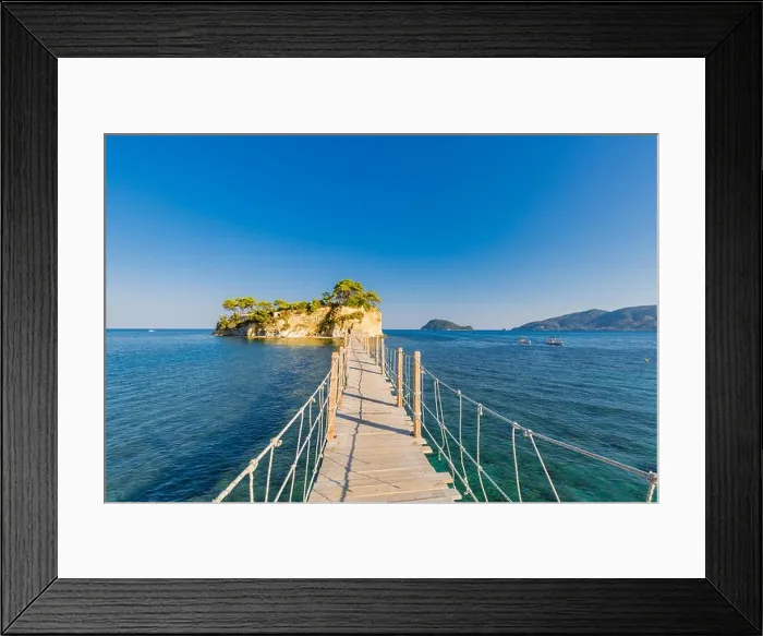 Framed Print : Wooden bridge from Agios Sostis leading to small rocky island. Bay of Laganas, Zakynthos island, Greece Framed Print : Wooden bridge from Agios Sostis leading to small rocky island. Bay of Laganas, Zakynthos island, Greece