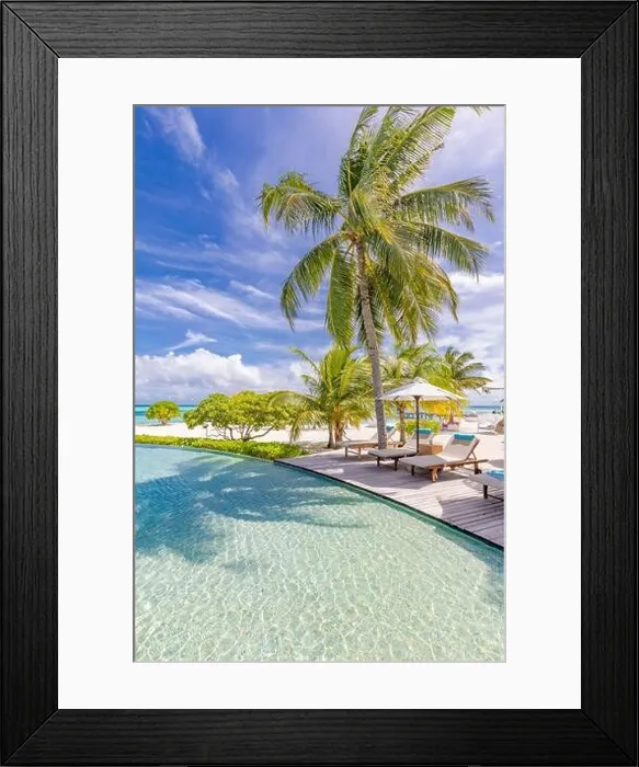 Framed Print : Summer tourism landscape. Luxurious beach resort with swimming pool and beach chairs or loungers under umbrellas infinity pool palm trees, blue sky Framed Print : Summer tourism landscape. Luxurious beach resort with swimming pool and beach chairs or loungers under umbrellas infinity pool palm trees, blue sky