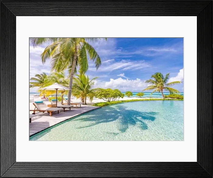 Framed Print : Summer tourism landscape. Luxurious beach resort with swimming pool and beach chairs or loungers under umbrellas infinity pool palm trees, blue sky Framed Print : Summer tourism landscape. Luxurious beach resort with swimming pool and beach chairs or loungers under umbrellas infinity pool palm trees, blue sky