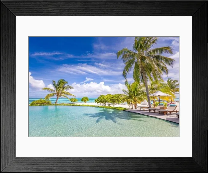 Framed Print : Summer tourism landscape. Luxurious beach resort with swimming pool and beach chairs or loungers under umbrellas infinity pool palm trees, blue sky Framed Print : Summer tourism landscape. Luxurious beach resort with swimming pool and beach chairs or loungers under umbrellas infinity pool palm trees, blue sky