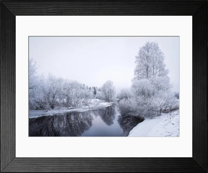 Framed Print : Winter landscape with frosty trees and peaceful river at evening in Finland Framed Print : Winter landscape with frosty trees and peaceful river at evening in Finland
