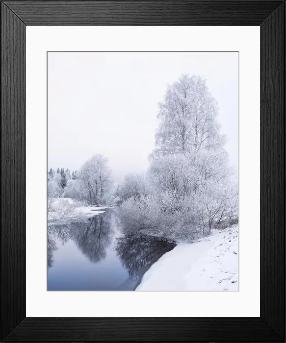 Framed Print : Winter landscape with frosty trees and peaceful river at evening in Finland Framed Print : Winter landscape with frosty trees and peaceful river at evening in Finland