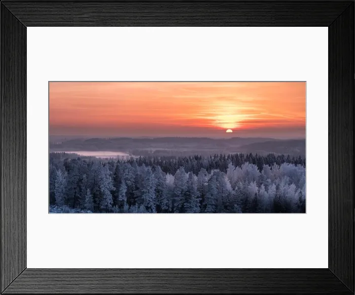 Framed Print : Winter landscape with frosty trees and beautiful sunset at evening time in Finland