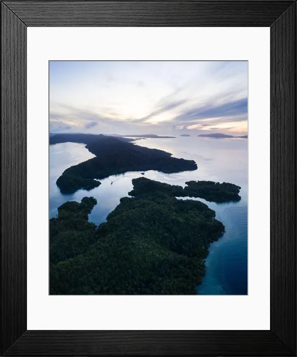 Framed Print : Beautiful coral reefs fringe remote limestone islands in Raja Ampat, Indonesia. The reefs here are home to the world's greatest marine biodiversity Framed Print : Beautiful coral reefs fringe remote limestone islands in Raja Ampat, Indonesia. The reefs here are home to the world's greatest marine biodiversity