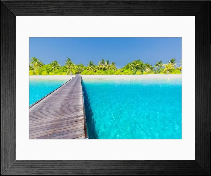 Framed Print : Maldives island beach panorama. Palm trees and beach bar and long wooden pier pathway. Tropical vacation and summer holiday background concept Framed Print : Maldives island beach panorama. Palm trees and beach bar and long wooden pier pathway. Tropical vacation and summer holiday background concept